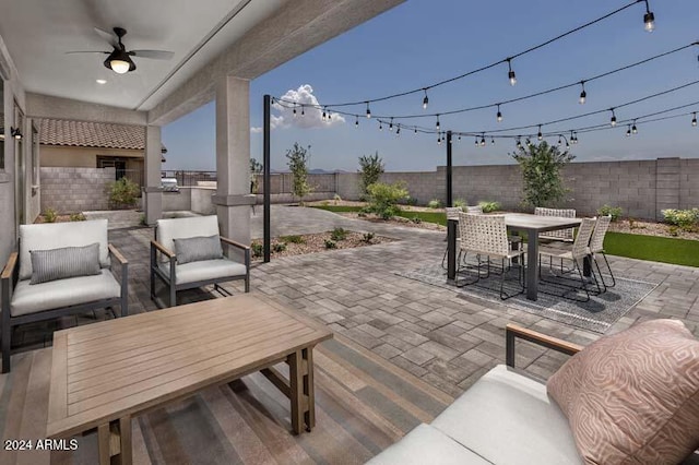 view of patio featuring an outdoor kitchen and ceiling fan