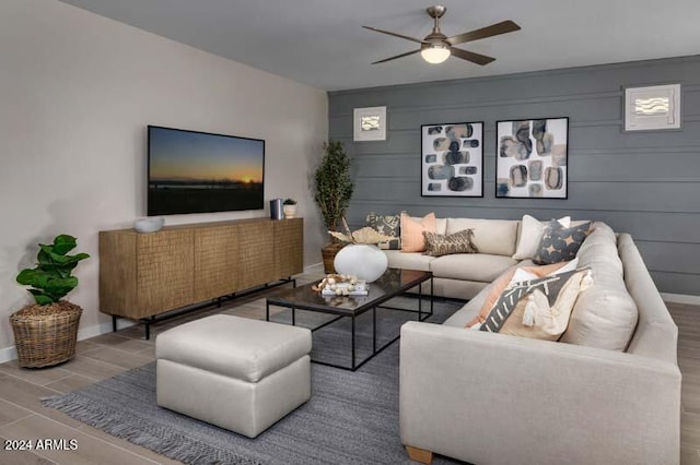 living room featuring hardwood / wood-style flooring and ceiling fan