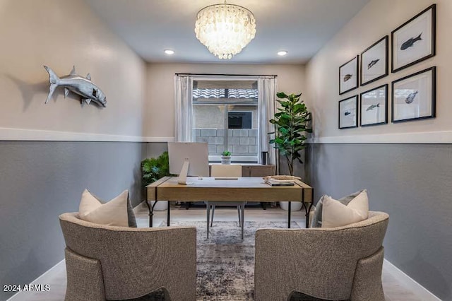 home office featuring hardwood / wood-style flooring and a chandelier