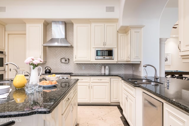 10754 E Laurel Ln, Scottsdale, AZ 85259 - kitchen featuring wall chimney exhaust hood, appliances with stainless steel finishes, dark stone counters, and tasteful backsplash