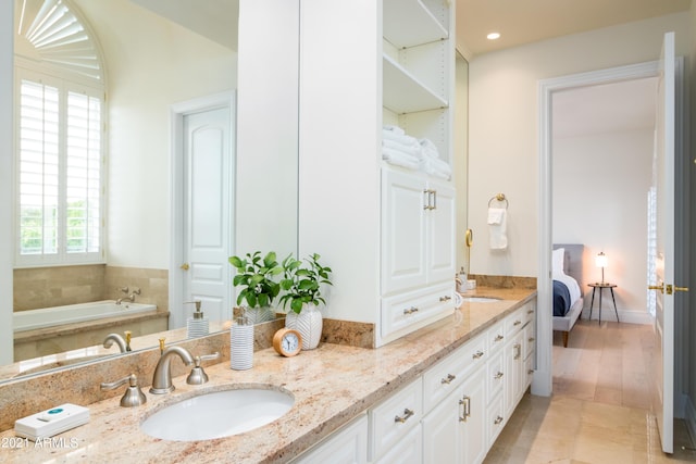 10754 E Laurel Ln, Scottsdale, AZ 85259 - bathroom featuring double vanity, ensuite bathroom, and a garden tub