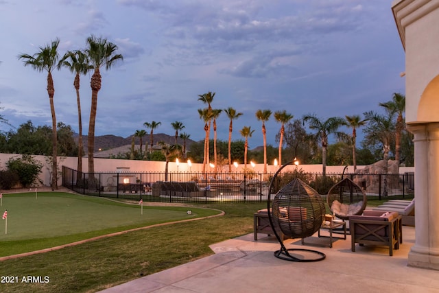 10754 E Laurel Ln, Scottsdale, AZ 85259 - view of patio / terrace featuring a putting area and a mountain view