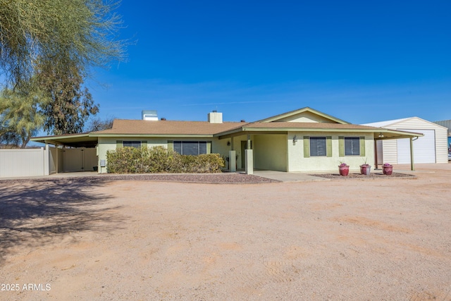 ranch-style home with a carport