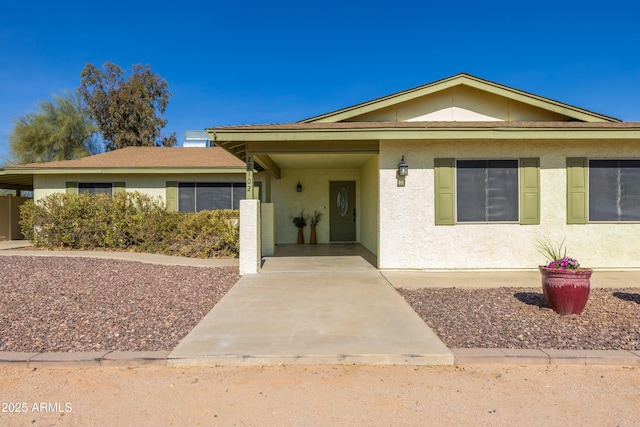 view of front facade with a carport