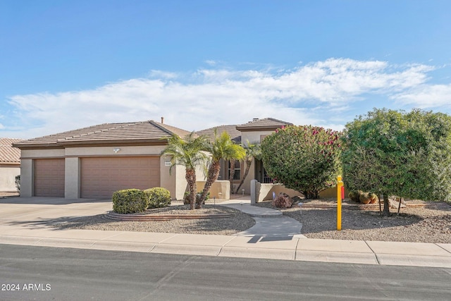 view of front of property featuring a garage