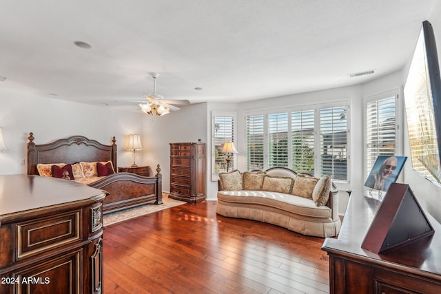 bedroom with hardwood / wood-style floors and ceiling fan