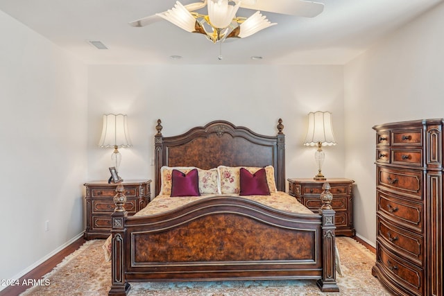 bedroom with ceiling fan and light hardwood / wood-style floors