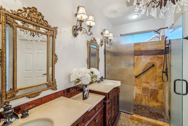 bathroom with vanity and a shower with shower door