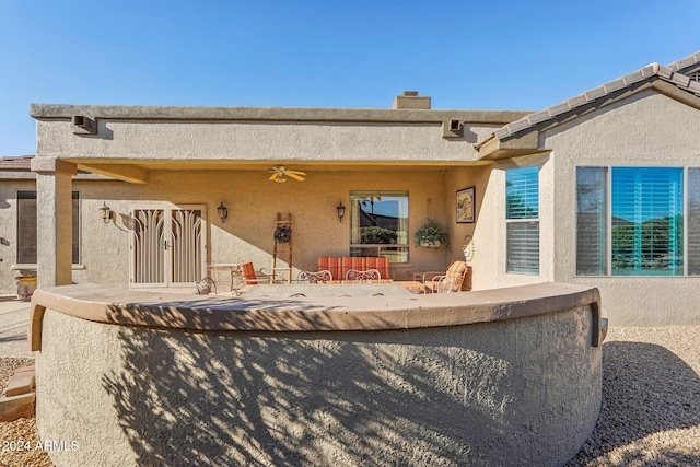 back of property featuring a patio