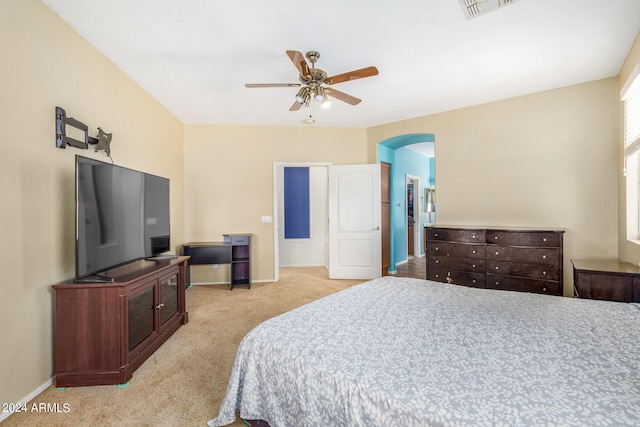 bedroom with light carpet and ceiling fan