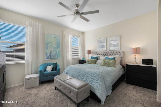 bedroom featuring ceiling fan and light carpet