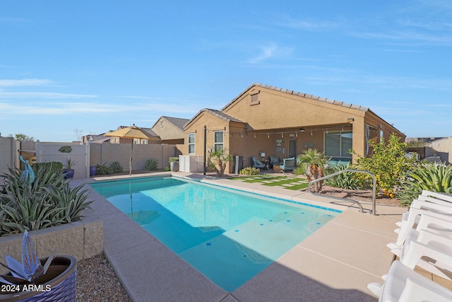 view of swimming pool featuring a patio area