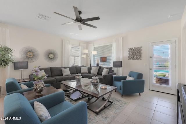 living room with ceiling fan and light tile patterned flooring