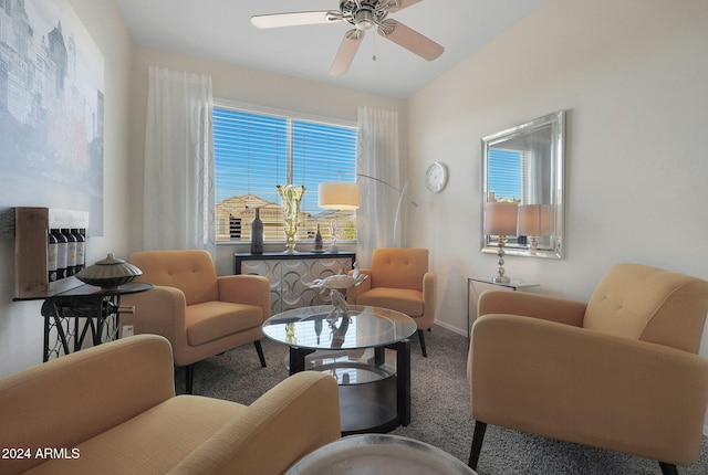 living area featuring ceiling fan, carpet, and vaulted ceiling