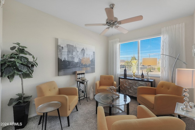 living area featuring ceiling fan and carpet floors