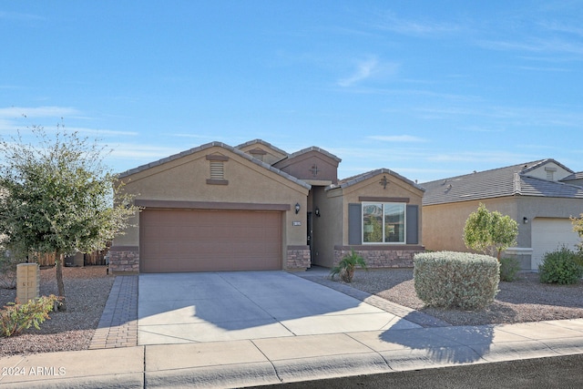 ranch-style home featuring a garage