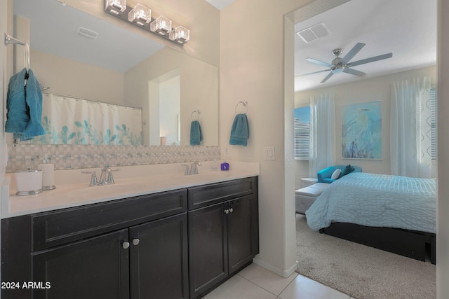 bathroom with tile patterned flooring, ceiling fan, and vanity