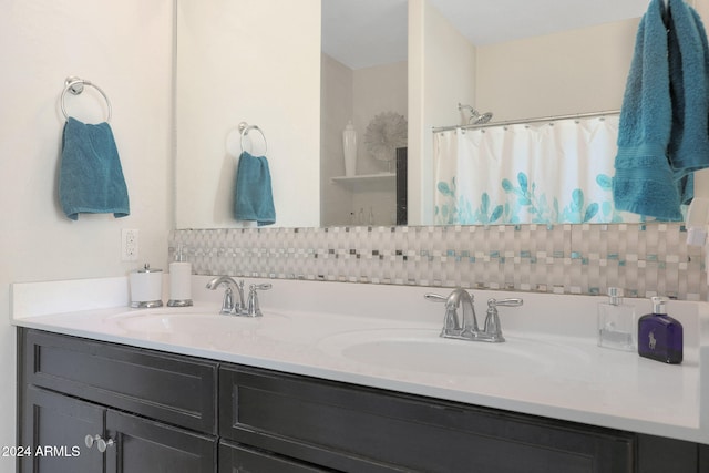 bathroom featuring a shower with shower curtain and vanity