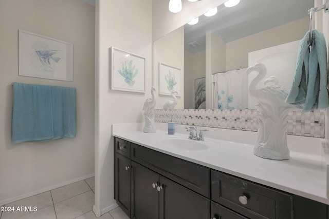 bathroom featuring tile patterned floors and vanity