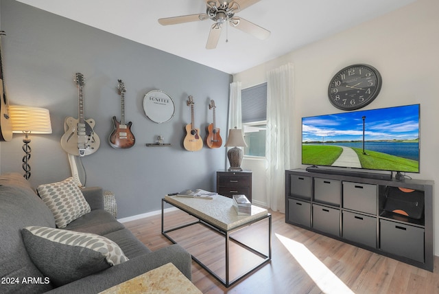 living room featuring ceiling fan and light wood-type flooring