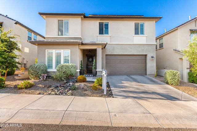 21186 W Hillcrest Blvd, Buckeye, AZ 85396 - view of front facade with stucco siding, an attached garage, and concrete driveway