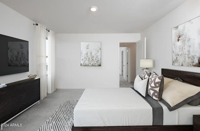 bedroom featuring light colored carpet