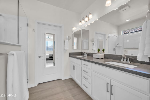 bathroom featuring vanity and a shower