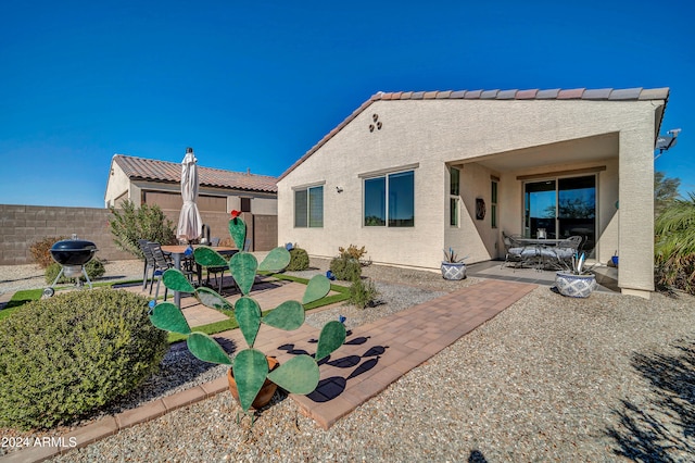 rear view of house featuring a patio area