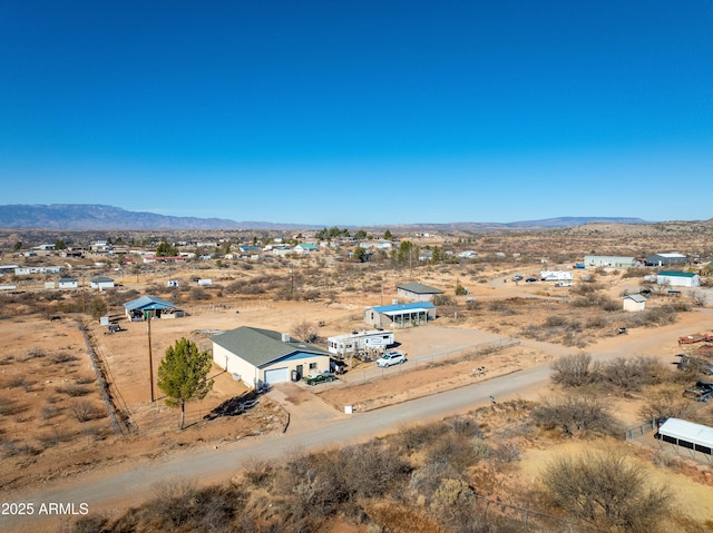 bird's eye view featuring a rural view, a mountain view, and a desert view