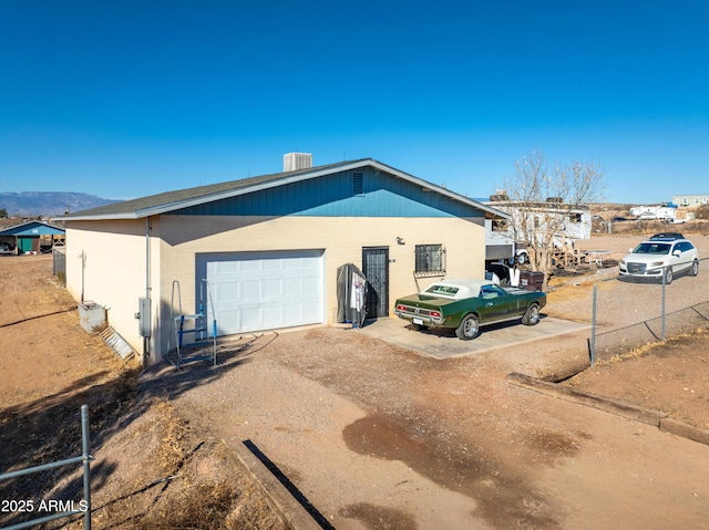 view of front of home featuring a garage and driveway