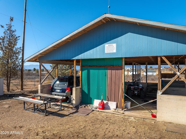 view of outdoor structure with a carport and an outdoor structure