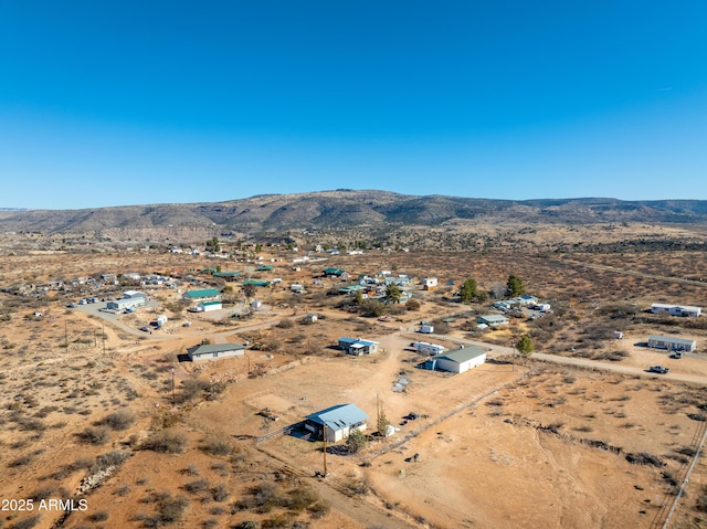 drone / aerial view with view of desert and a mountain view