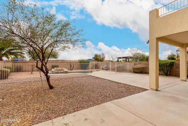 view of yard featuring a fenced in pool and a patio area