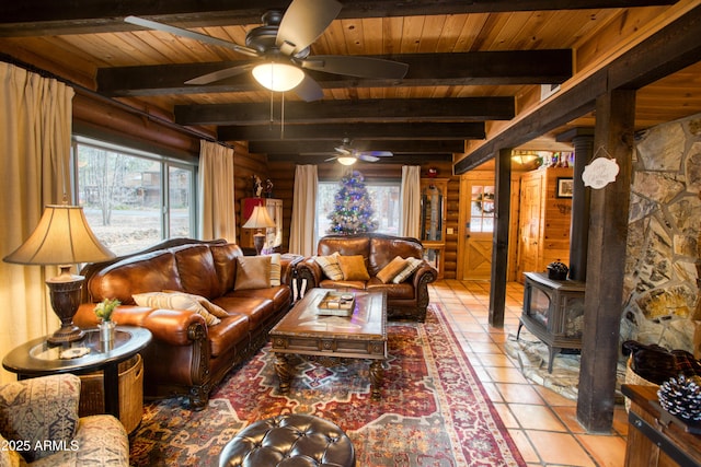 tiled living room with beamed ceiling, a wood stove, and wood ceiling