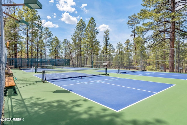 view of sport court featuring basketball hoop