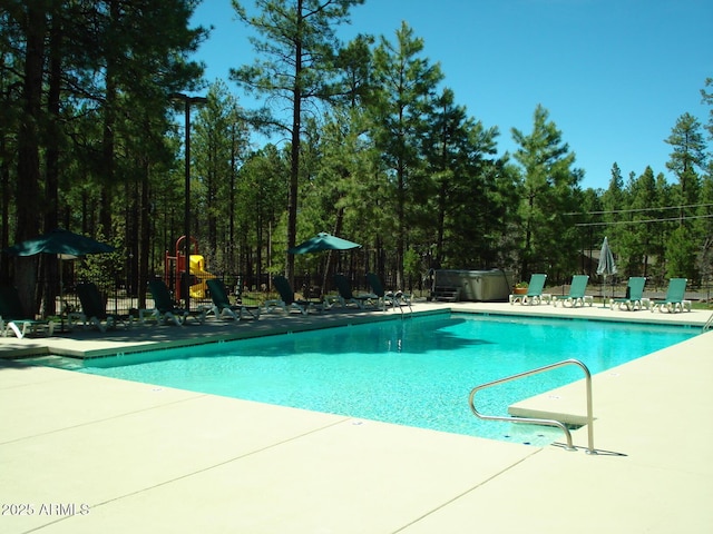 view of swimming pool with a patio