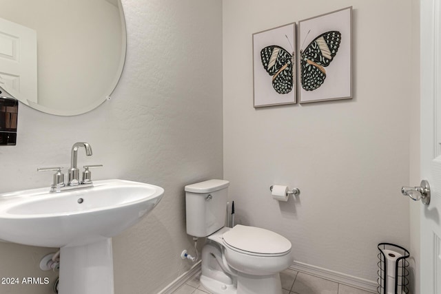 bathroom featuring tile patterned floors, sink, and toilet