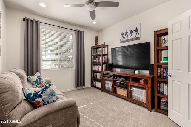 carpeted living room featuring ceiling fan