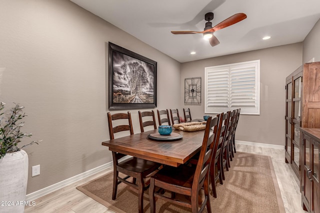 dining space featuring light hardwood / wood-style flooring and ceiling fan