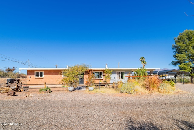 view of front of home featuring a carport