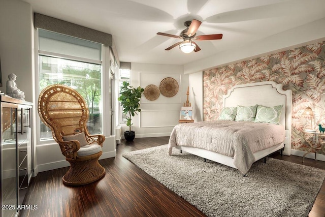 bedroom featuring dark hardwood / wood-style flooring and ceiling fan