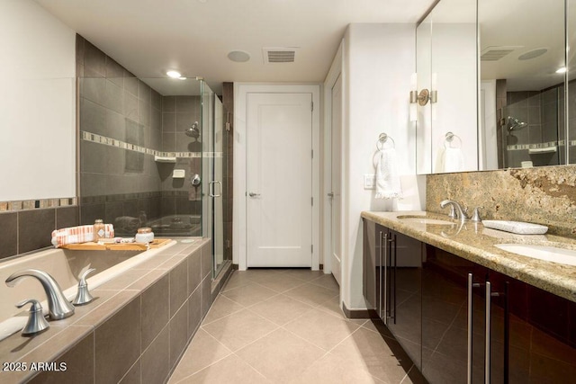 bathroom with tile patterned floors, plus walk in shower, and vanity