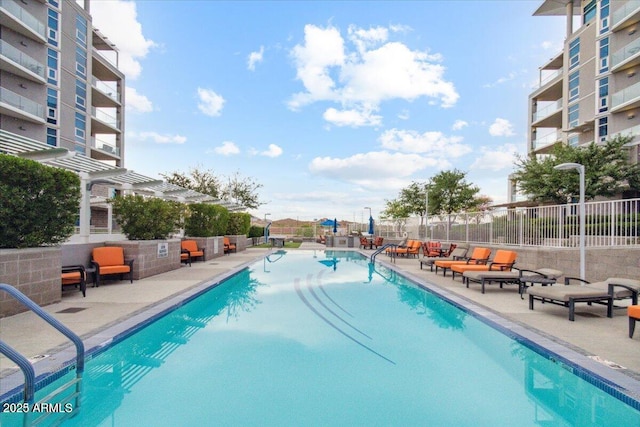 view of swimming pool featuring a patio