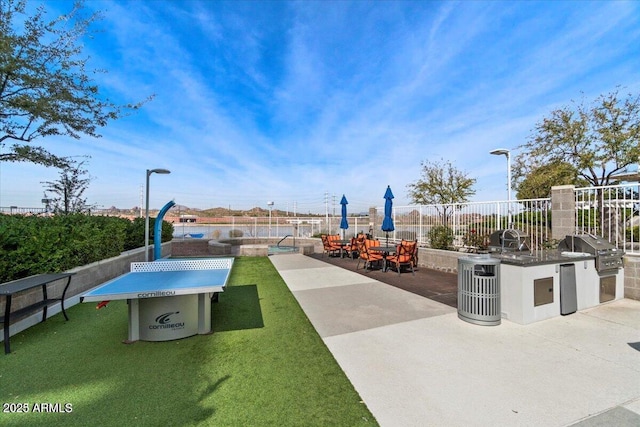 view of patio / terrace featuring area for grilling, grilling area, and a swimming pool