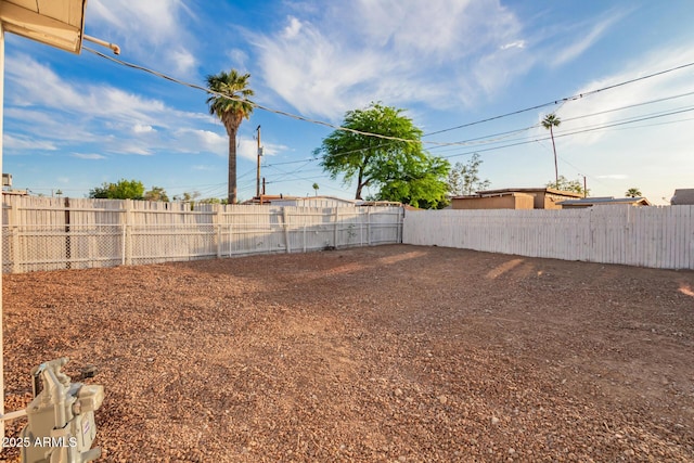view of yard with a fenced backyard