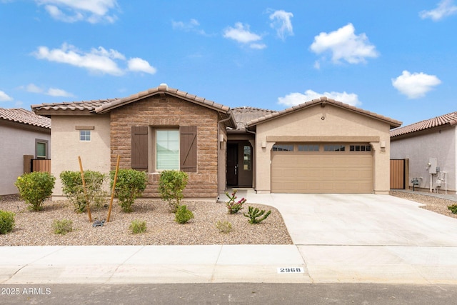 2968 E Tundra Ln, San Tan Valley, AZ 85143 - view of front of property with stucco siding, an attached garage, a tiled roof, and concrete driveway