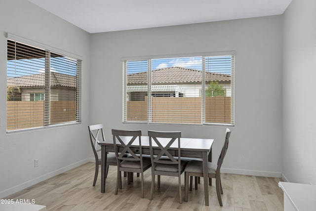 2968 E Tundra Ln, San Tan Valley, AZ 85143 - dining area with baseboards and light wood-type flooring