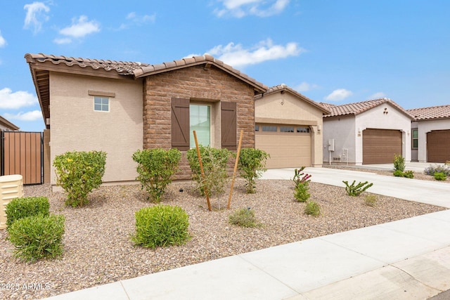 2968 E Tundra Ln, San Tan Valley, AZ 85143 - view of front of home with stucco siding, a garage, a tiled roof, and concrete driveway