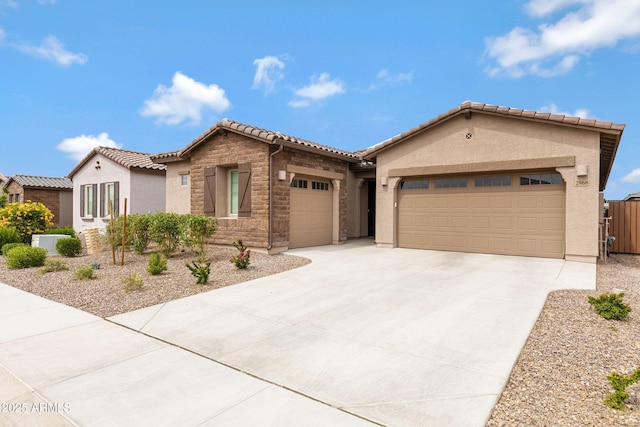 2968 E Tundra Ln, San Tan Valley, AZ 85143 - view of front of home with stone siding, a tiled roof, an attached garage, concrete driveway, and stucco siding