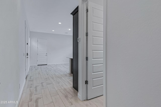 2968 E Tundra Ln, San Tan Valley, AZ 85143 - hallway with baseboards, wood tiled floor, and recessed lighting